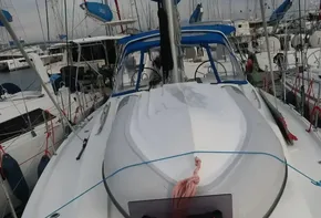 2019 Beneteau Oceanis 41.1 sailboat docked in marina, featuring sleek deck design.