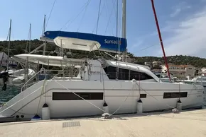 2019 Leopard 40 catamaran docked at a marina with scenic hillside background.