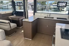 Modern interior of 2025 Leopard 46 yacht with sleek kitchen and helm station.