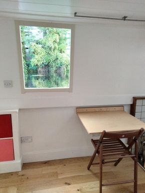 Side hatch in kitchen with folding table
