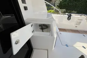 2024 Leopard 40 Powercat deck with open storage compartment.