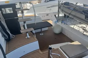 2024 Lagoon 42 yacht deck with wooden flooring and modern seating area.