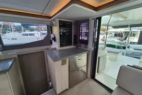 Interior view of a 2020 Leopard 45 catamaran, featuring modern navigation equipment and sleek design.