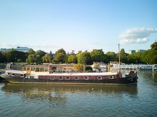 Luxe motor Dutch Barge moored in Dove Pier
