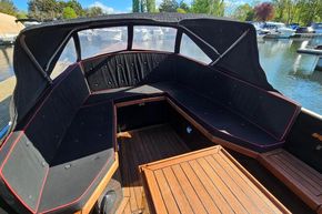 Luxurious 2008 Menken Maritiem The Cab motor yacht interior with elegant seating and wooden flooring.