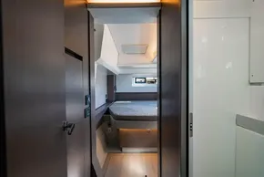 Interior cabin of 2025 Leopard 46 yacht, featuring modern design and cozy sleeping area.