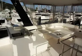 2017 Leopard 43 Powercat yacht interior with white seating and marina view.