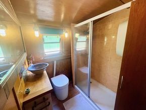 Bathroom with spacious shower and convenient separating toilet