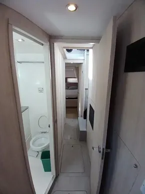 Interior hallway of 2019 Leopard 45 yacht with bathroom and bedroom view.