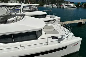 2025 Robertson and Caine Leopard 46 Powercat docked in a marina, showcasing sleek design.
