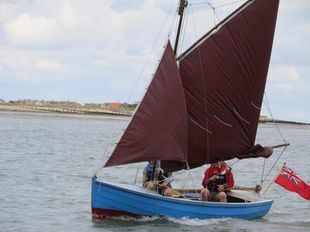 Gaff rigged open boat