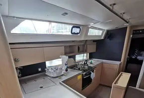 Interior of 2020 Beneteau Oceanis 46.1 yacht, featuring modern kitchen and seating area.