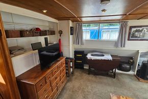 Interior of a 1926 Dutch Barge Luxemotor with vintage furnishings and decor.
