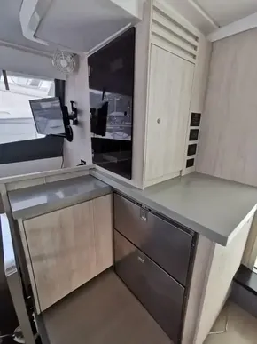 Modern kitchen area in 2017 Leopard 51 Powercat yacht with sleek cabinetry and appliances.