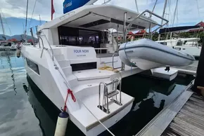 Luxury Leopard 45 catamaran docked, featuring a dinghy and modern design, 2020 model.