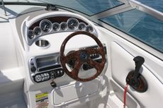 Crownline Cuddy Cabin 255 CCR - A fully equipped helm includes full instrumentation with lifetime warranty, tilt steering and Woodgrain dash with full wood wheel, all standard.