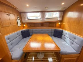 Galley - dining area. with switched stainless steel reading lights. The table can be lowered to make up a double bed