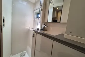 Modern bathroom interior in a 2021 Leopard 45 yacht, featuring sleek fixtures and cabinetry.