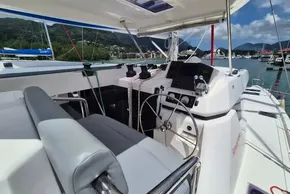 Helm of 2021 Leopard 45 catamaran docked in scenic marina setting.