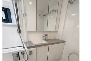Modern bathroom in 2020 Leopard 45 yacht with shower, sink, and toilet.