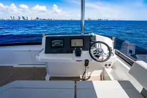 Helm of 2025 Leopard 40 Powercat with ocean view and modern navigation equipment.