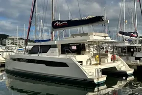 2021 Leopard 50 catamaran docked at marina, featuring sleek design and spacious deck.