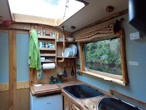 12sq ft lift up skylight, live branchwood shelves and live edge windows