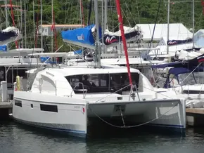2021 Leopard 40 catamaran docked at marina, featuring sleek design and modern sails.