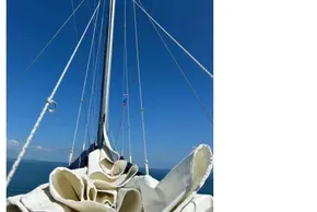 Sailboat mast and rigging on a 2022 Leopard 42 against a clear blue sky.