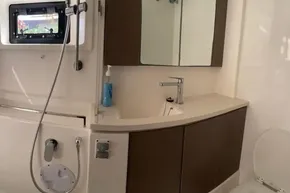 Modern bathroom interior on 2022 Leopard 45 yacht, featuring sleek sink and shower.