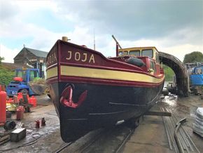 Classic 1927 Dutch barge in dry dock.