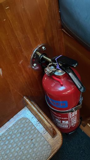 Engine bay fire extinguisher