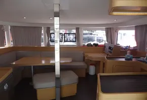 Interior of 2020 Lagoon 42 catamaran with dining area and navigation station.