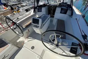 2020 Jeanneau Sun Odyssey 389 cockpit with dual steering wheels and navigation equipment.