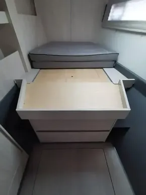 Interior cabin of a 2017 Leopard 51 Powercat with a bed and storage compartments.