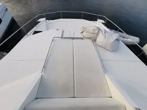 Front deck of 2017 Leopard 51 Powercat yacht with cushioned seating.