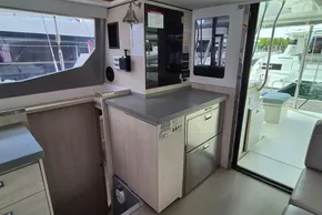 Modern kitchen area on a 2021 Leopard 45 yacht, featuring sleek cabinetry and appliances.