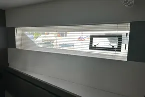 Interior view of 2022 Leopard 53 Powercat with window blinds partially open.