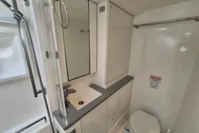 Modern bathroom in a 2020 Leopard 45 yacht, featuring sleek fixtures and compact design.