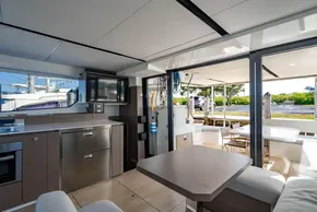 Luxurious interior of 2025 Leopard 46 yacht with modern kitchen and outdoor seating.