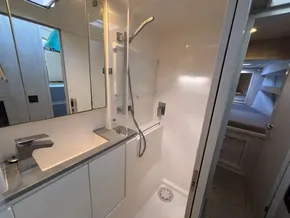 Modern bathroom interior on a 2019 Leopard 40 yacht, featuring sleek fixtures and ample lighting.