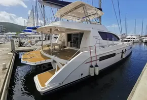 2016 Leopard 58 catamaran docked at a marina on a sunny day.