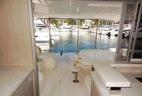 Interior view of 2015 Leopard 51 Powercat yacht with marina backdrop.