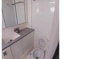 Compact bathroom in a 2018 Leopard 45 yacht, featuring modern fixtures and storage.