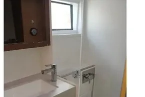 Bathroom interior of 2020 Lagoon 46 yacht with sink and shower.