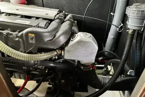 Engine compartment of a 2023 Beneteau Oceanis 51.1 sailboat, showcasing mechanical components.