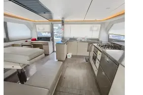 Luxurious interior of 2020 Leopard 50 yacht with modern kitchen and seating area.