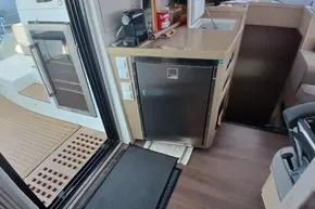 Interior of 2024 Lagoon 42 yacht, featuring modern kitchen and sleek design elements.