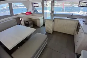 Modern interior of 2018 Leopard 45 catamaran with spacious kitchen and dining area.