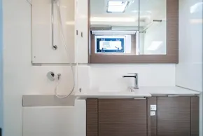 Modern bathroom in 2025 Leopard 46 yacht with sleek fixtures and wood accents.
